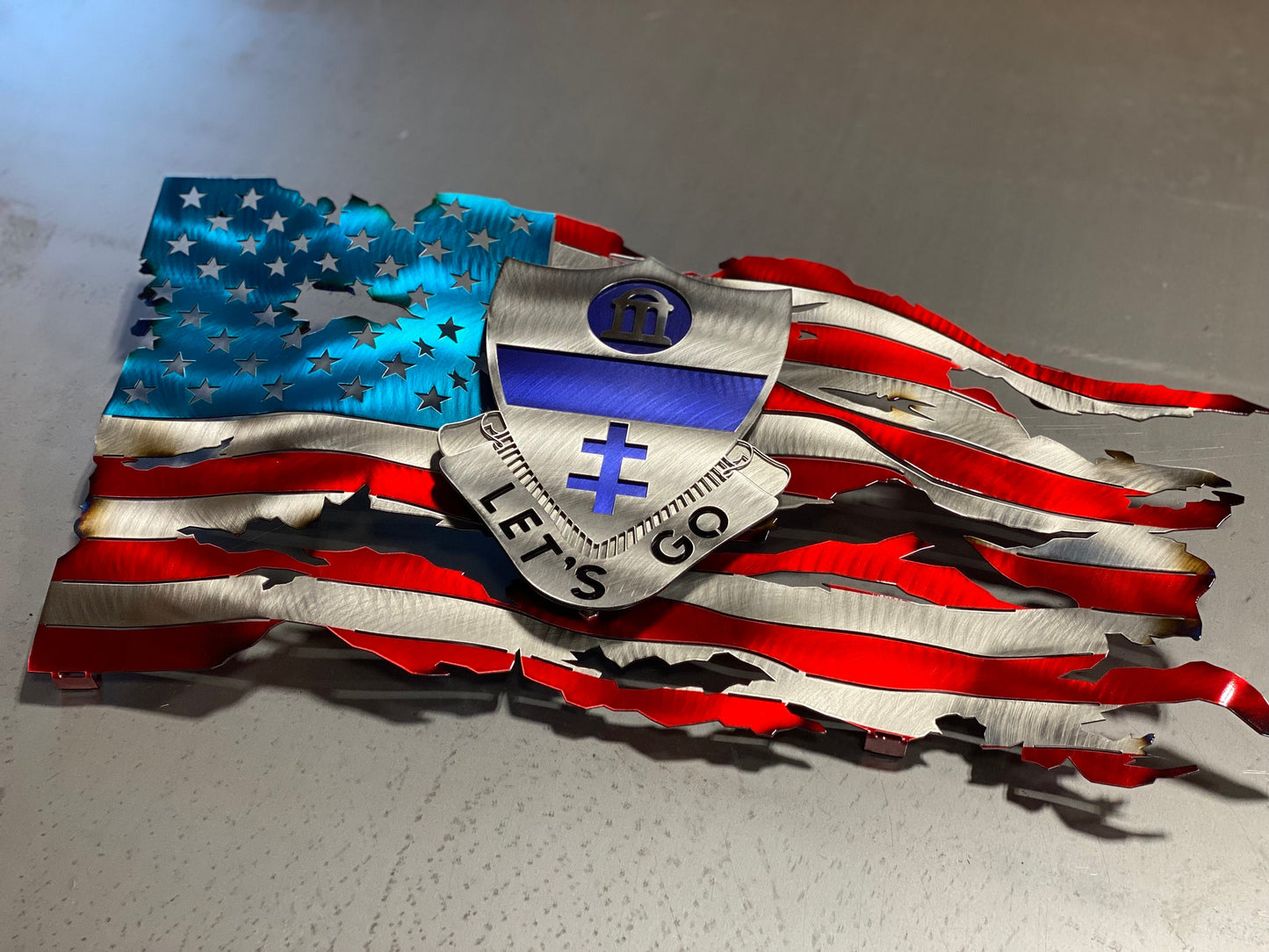 Metal tattered American flag with 325th Airborne Infantry Regiment emblem