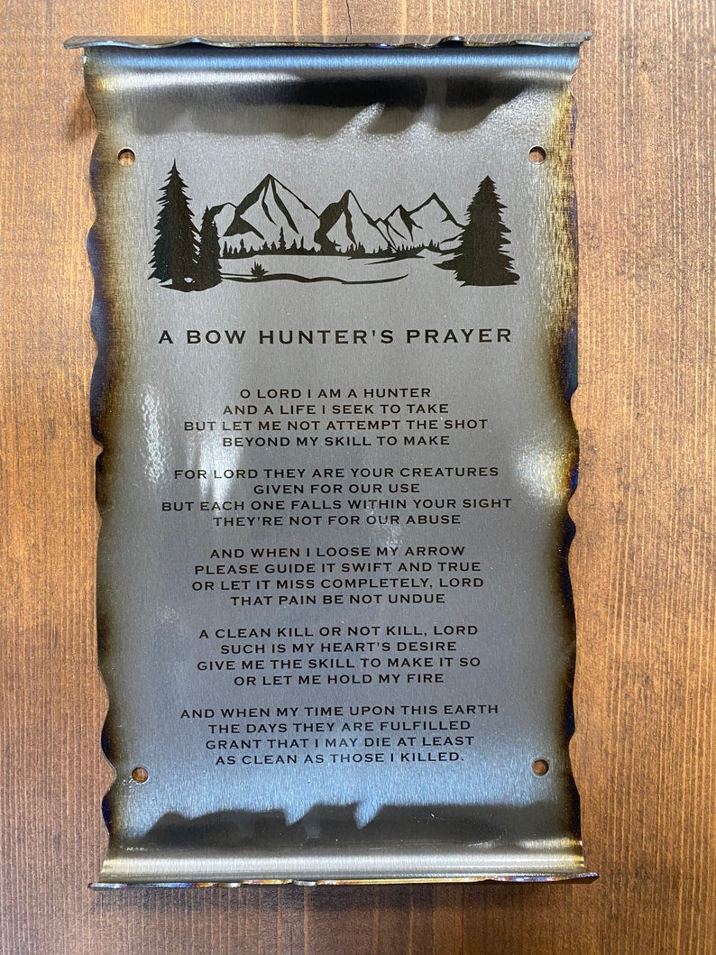 metal scroll featuring a mountain and engraved Bow Hunter's Prayer