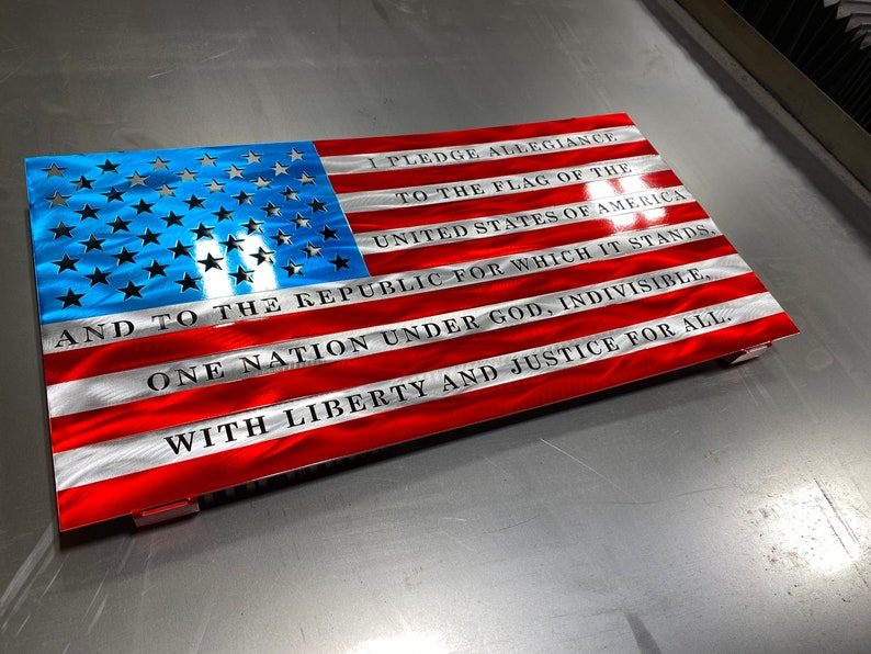 Metal American flag with Pledge of Allegiance in vibrant red, white, and blue
