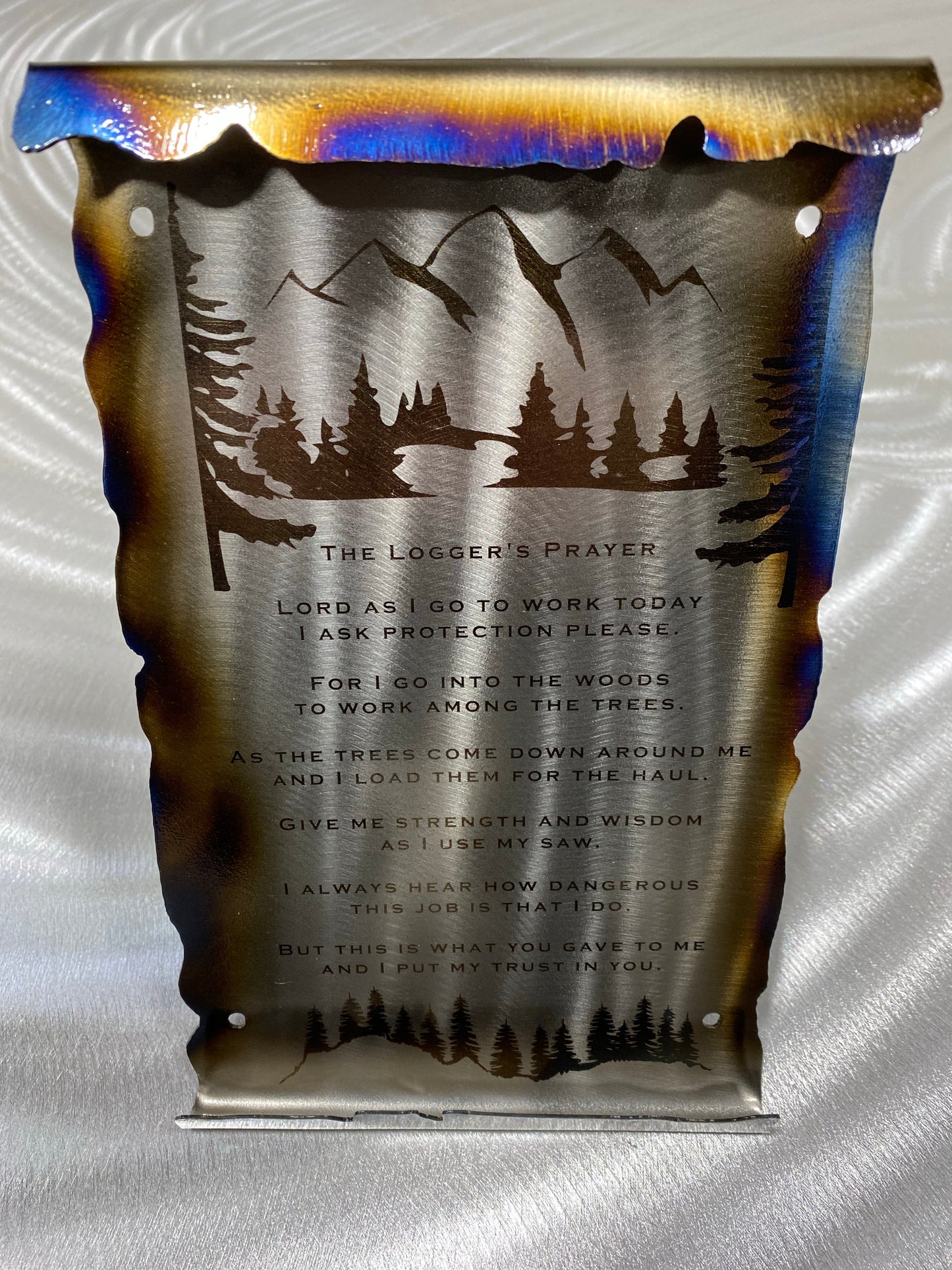 Loggers Prayer Scroll Sign, handcrafted metal wall art with laser-etched tree line and prayer, heat patina accents, and scroll edges
