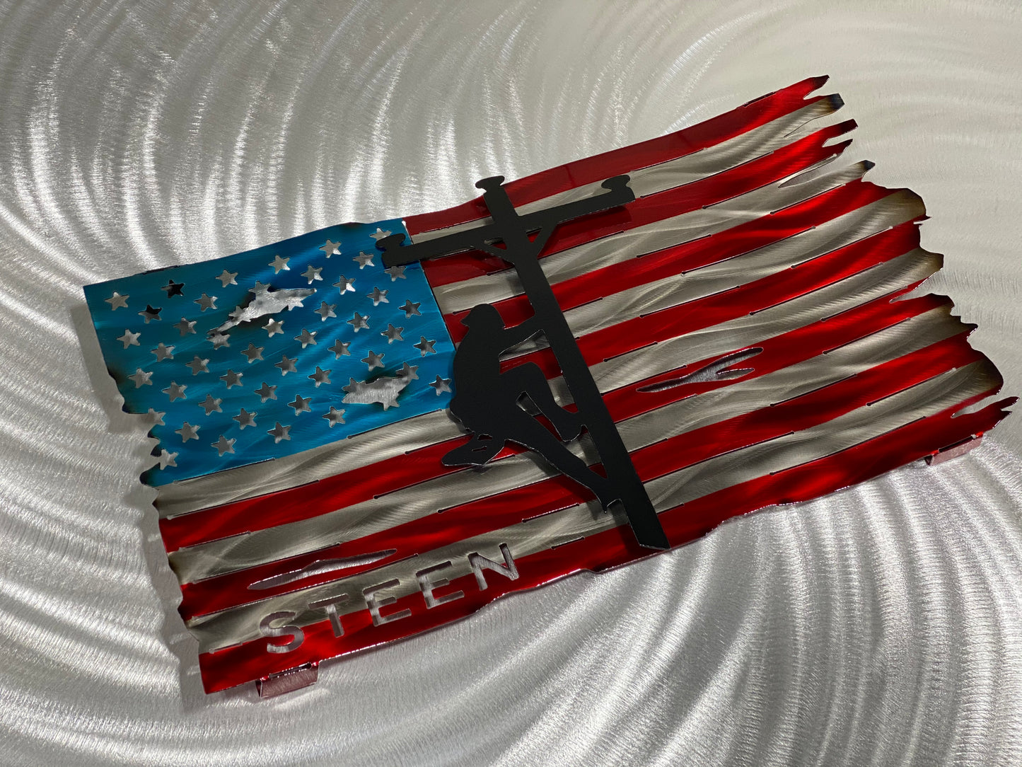 Tattered Lineman Flag with Personalization, handcrafted metal wall art featuring a floating lineman silhouette and custom details, made by CnS CnC.