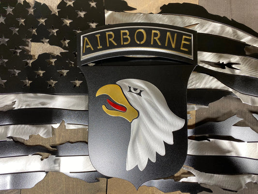 Tattered metal American flag featuring the 101st Airborne Division emblem in black and silver.