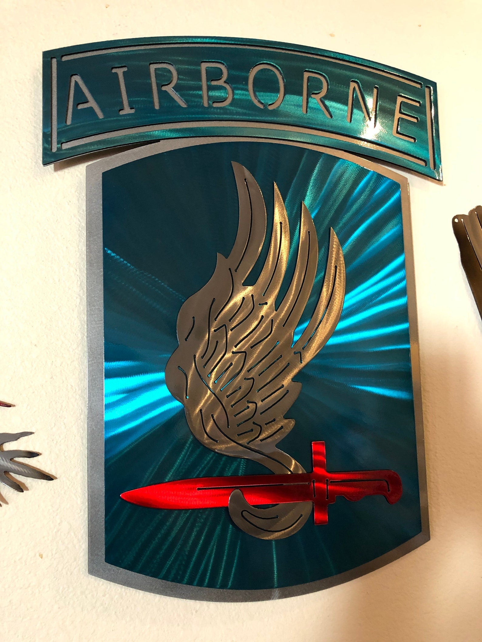 Layered metal wall art of the 173rd Airborne Brigade with candy powder coat finish.
