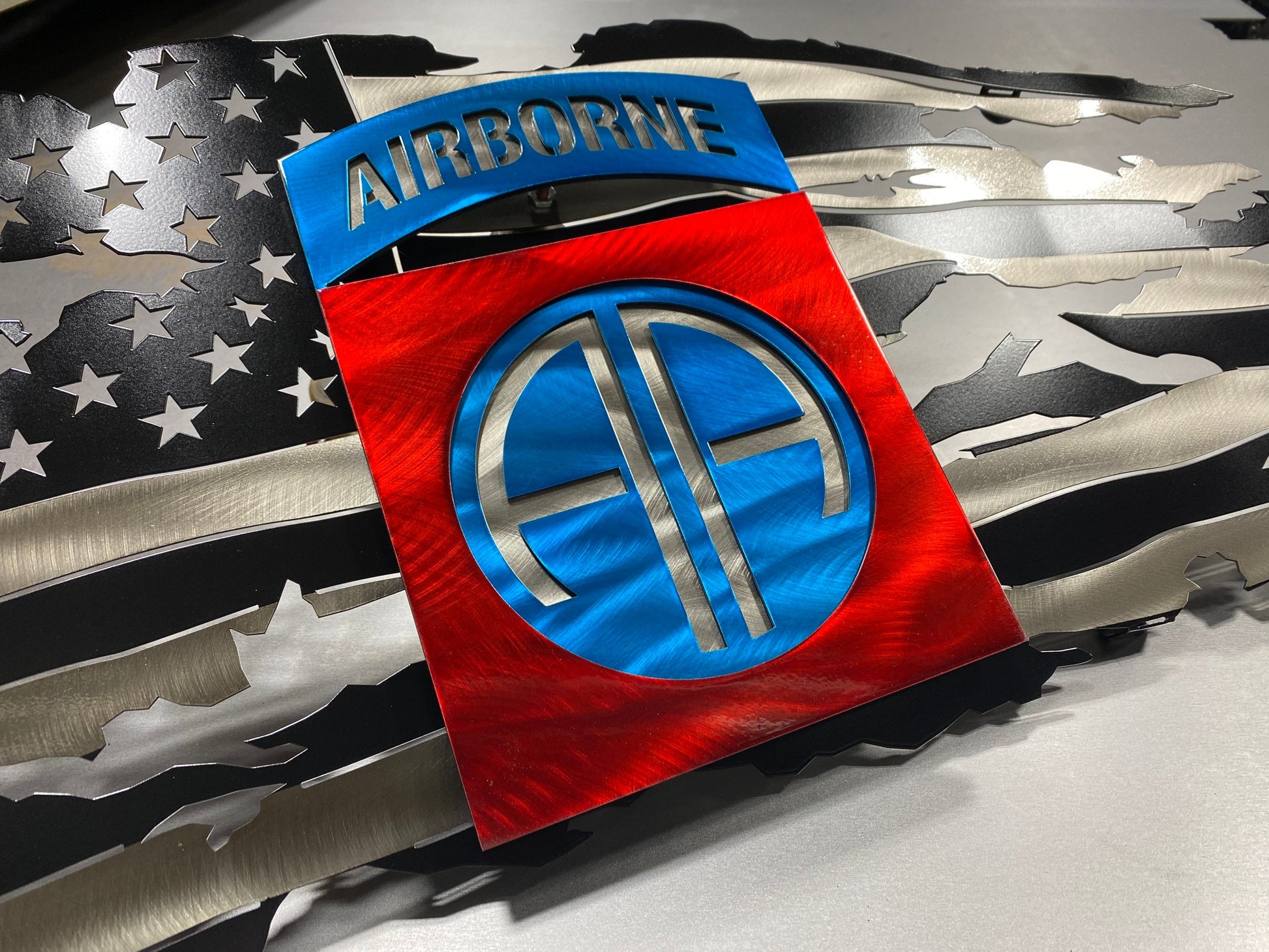 Metal American flag with 82nd Airborne Brigade emblem

