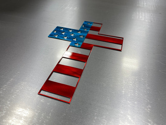 Metal cross wall art with American flag design representing faith and patriotism