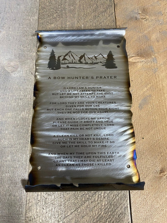 metal scroll featuring a mountain  and engraved Bow Hunter's Prayer
