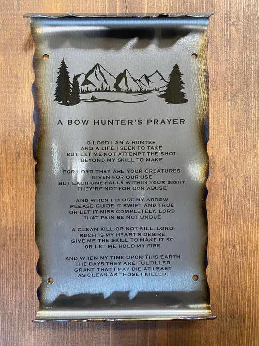 metal scroll featuring a mountain  and engraved Bow Hunter's Prayer