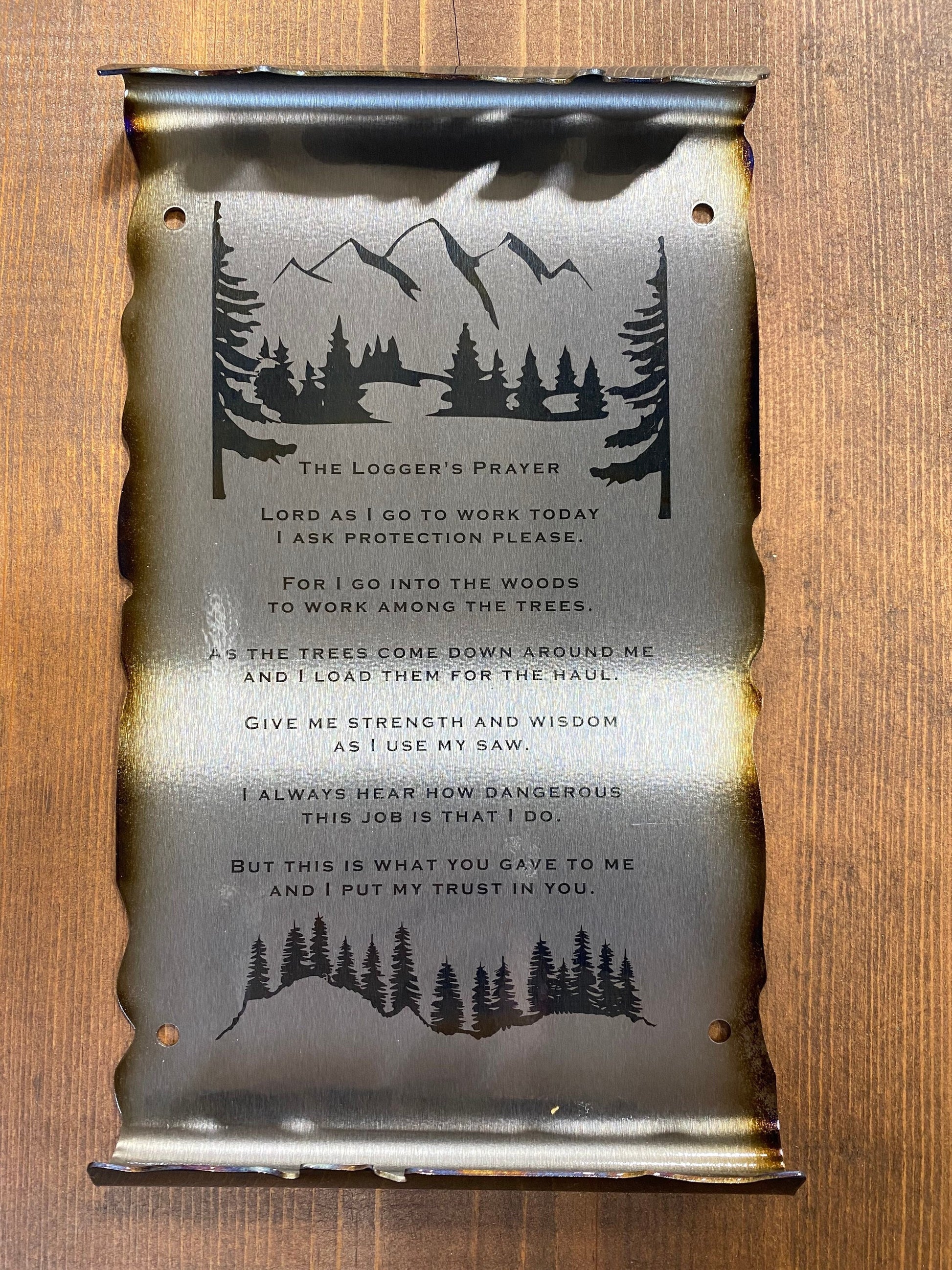 Loggers Prayer Scroll Sign, handcrafted metal wall art with laser-etched tree line and prayer, heat patina accents, and scroll edges by CnS CnC.