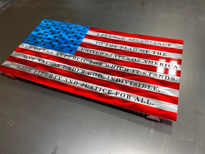 Metal American flag with Pledge of Allegiance in vibrant red, white, and blue

