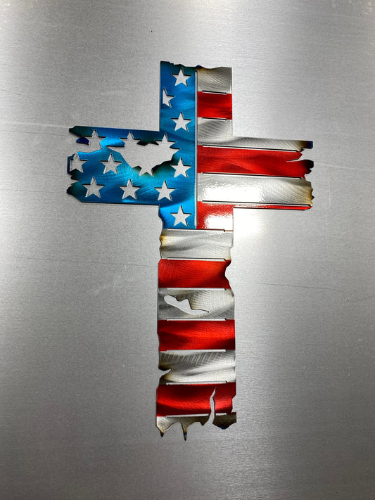 Metal cross wall decor with tattered American flag overlay

