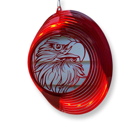 Patriotic metal wind spinner featuring a bald eagle design for outdoor display