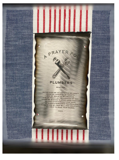 CNC cut metal Plumber’s Prayer scroll with heat patina finish and powder coat, made from American steel

