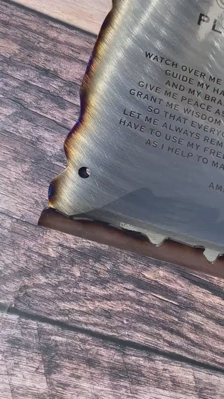 CNC cut metal Plumber’s Prayer scroll with heat patina finish and powder coat, made from American steel
