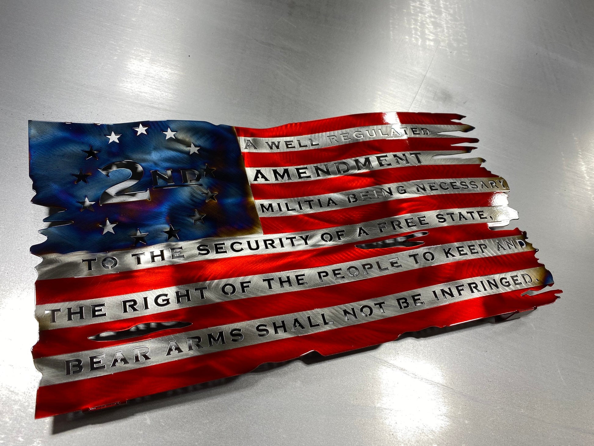 Tattered wavy metal American flag featuring “We the People” and “Come and Take It” phrases with candy red and heat finish.