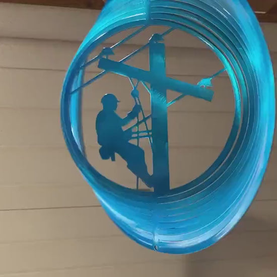 Lineman wind spinner made from powder coated metal for patriotic garden decor