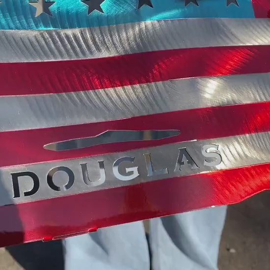 Metal American flag with raised Caduceus emblem for nurses