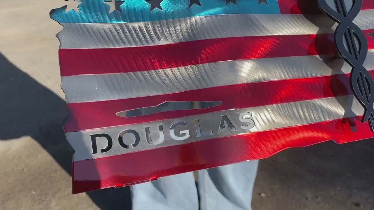Metal American flag with raised Caduceus emblem for nurses