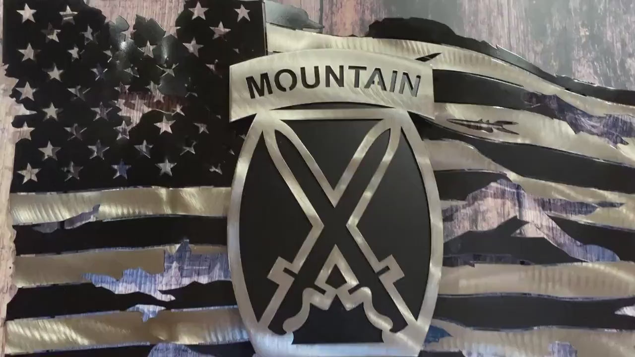 Battle-worn American flag wall art with floating 10th Mountain Division emblem in layered steel.