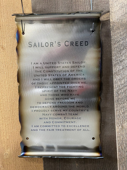 Metal Sailor’s Creed scroll laser engraved on American steel with powder coat and patina, 6x10 inches