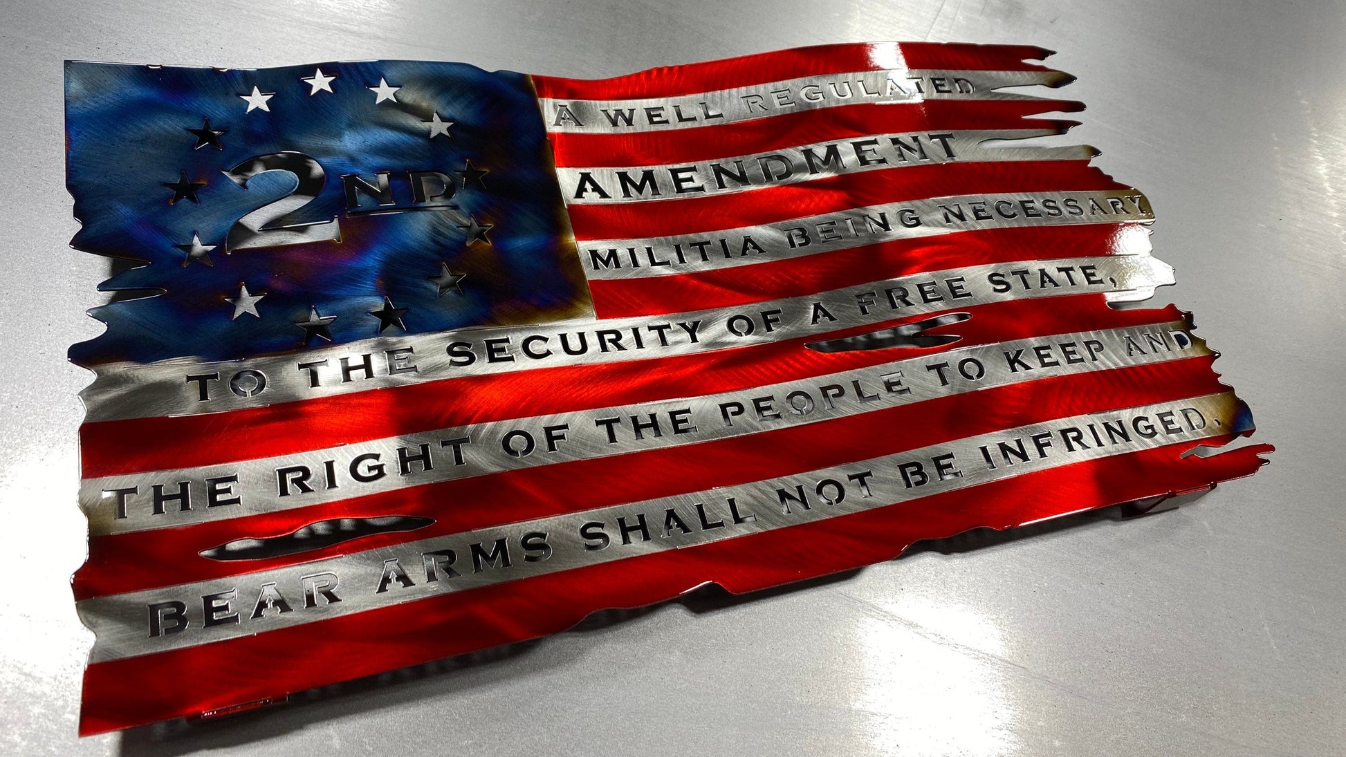 Tattered wavy metal American flag featuring “We the People” and “Come and Take It” phrases with candy red and heat finish.