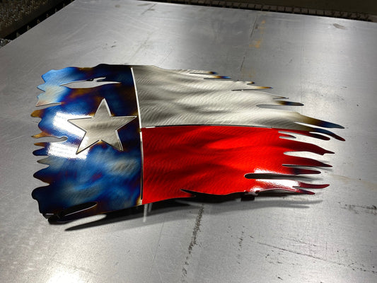 Tattered Texas flag made of metal with red, white, and blue powder coat