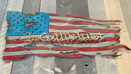 We The People Battle Worn Metal Flag, handcrafted from American steel with a rugged, battle-worn design and powder-coated finish 