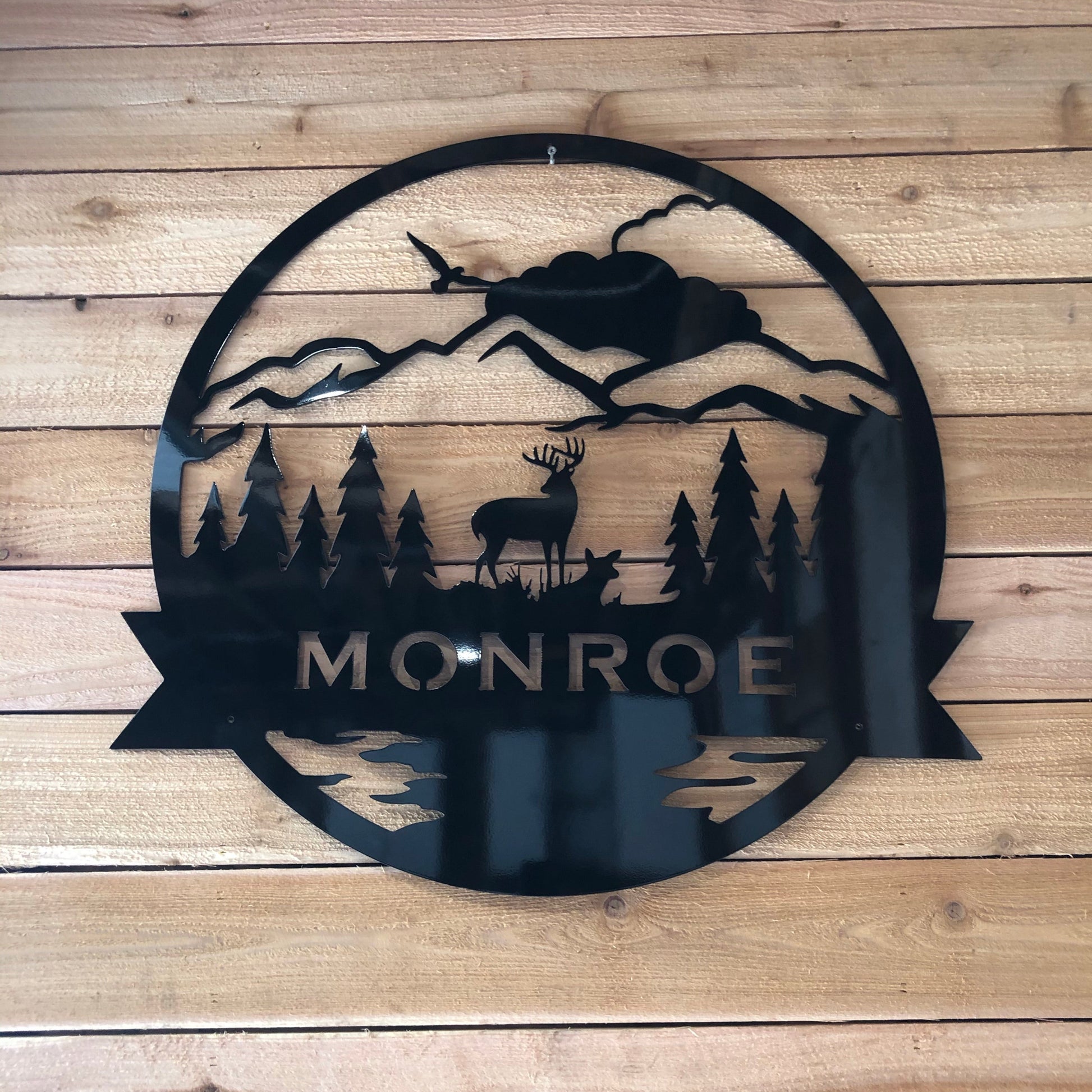 Nature-Themed Family Monogram, handcrafted metal sign personalized with a last name and animal silhouette, made from marine-grade aluminum 