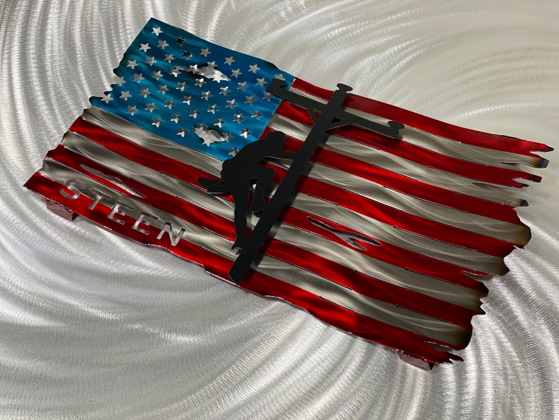 Personalized Lineman Metal Flag, handcrafted steel wall art with a custom lineman silhouette, featuring a waved American flag design by CnS CnC.