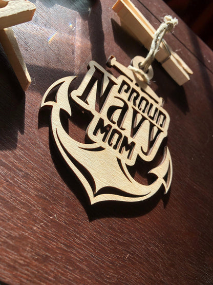 Proud Navy Mom ornament laser-cut from Baltic Birch, featuring intricate details and perfect for Christmas tree display.