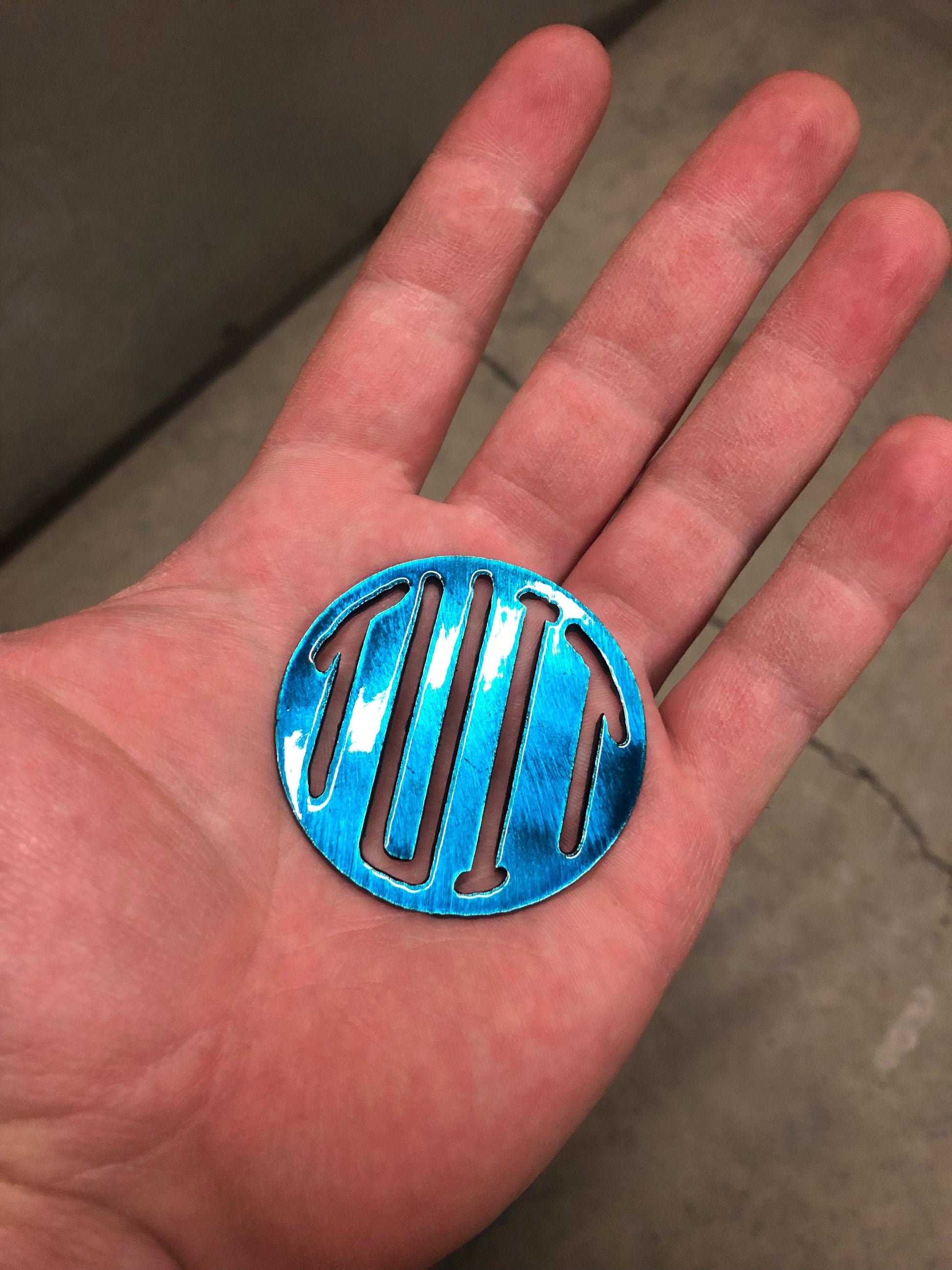 Round Tuit metal keychain, 2 inches, precision laser-cut and powder-coated for durability. A funny procrastinator gag gift.