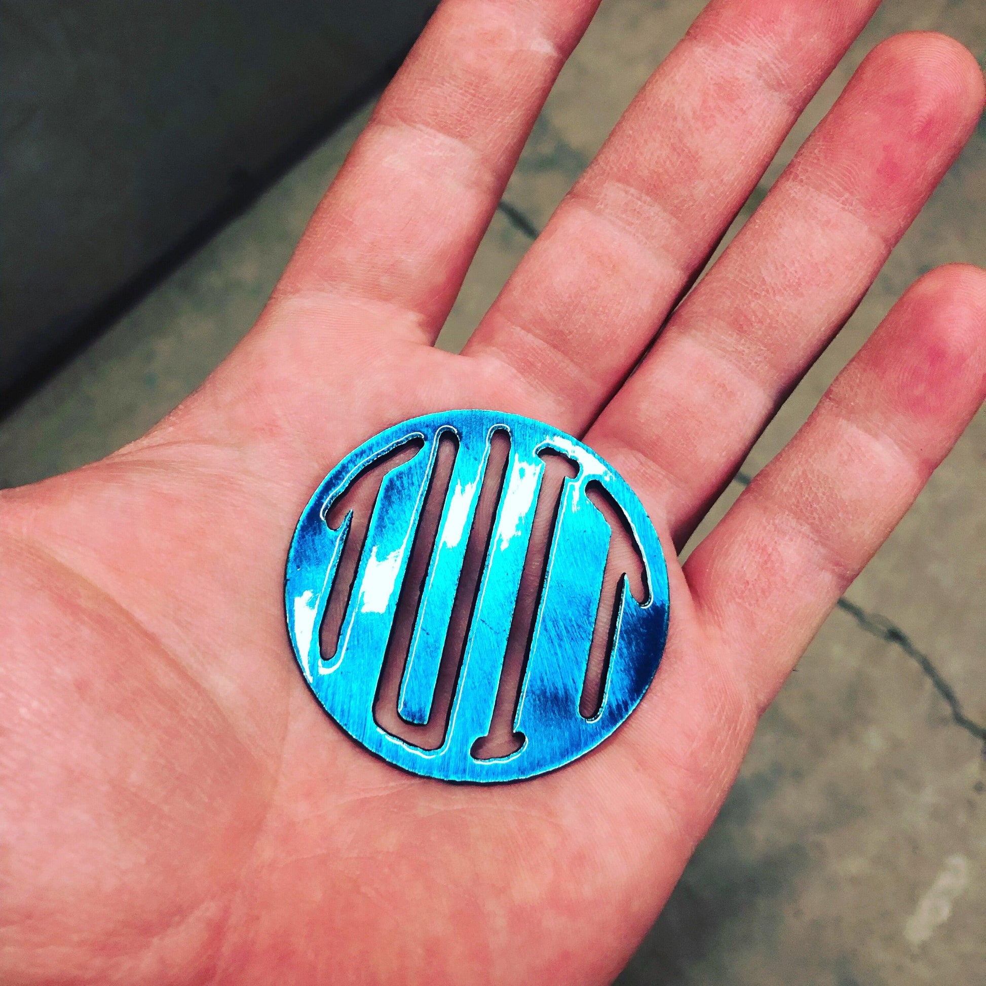 Round Tuit metal keychain, 2 inches, precision laser-cut and powder-coated for durability. A funny procrastinator gag gift.