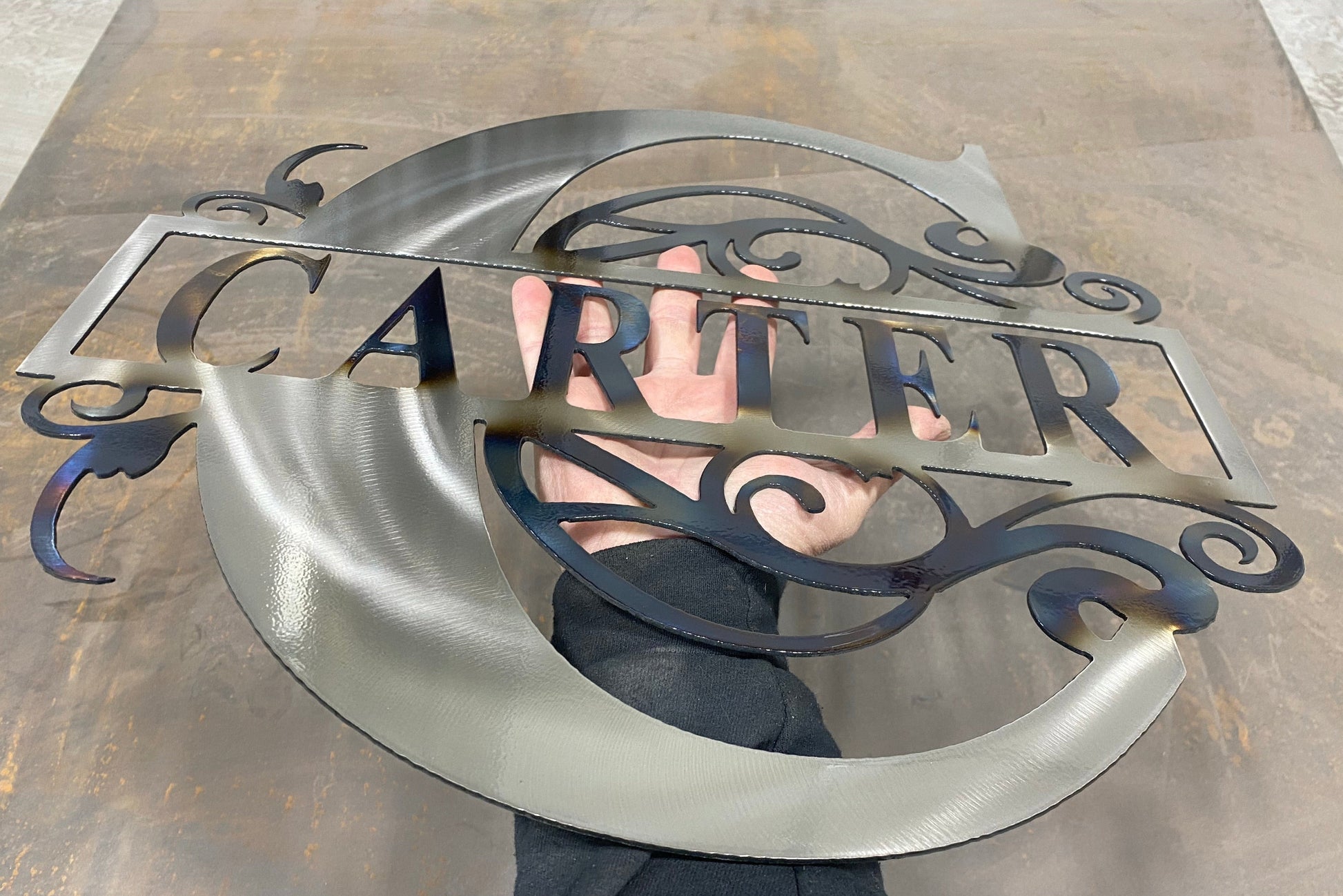 Split Letter Monogram, handcrafted metal family name sign with a heat-treated finish, personalized design, and clear powder coat by CnS CnC.


