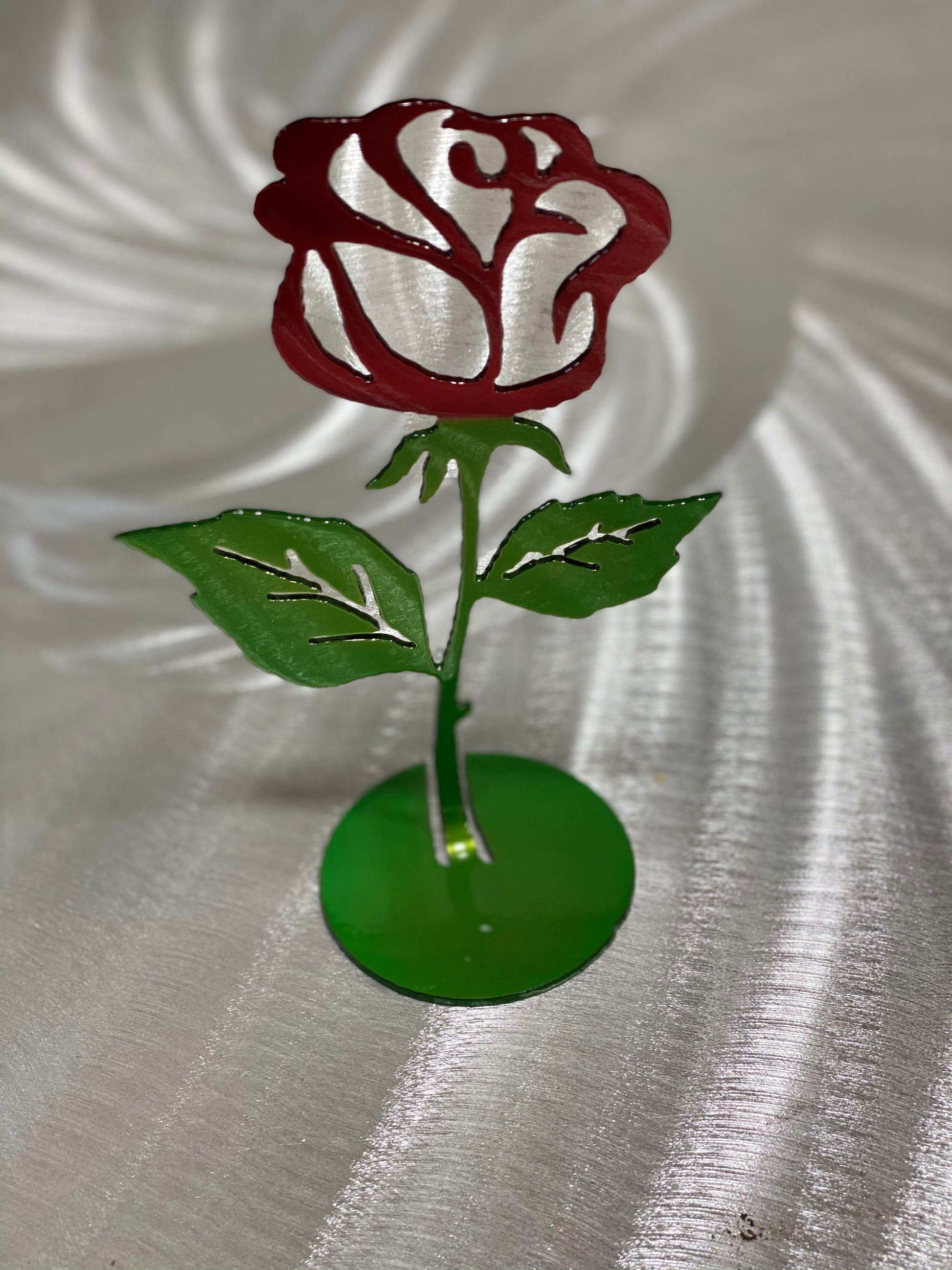 Steel Rose Cutout, handcrafted metal rose with candy red and green powder coat finish, available flat or with a standing base by CnS CnC.
