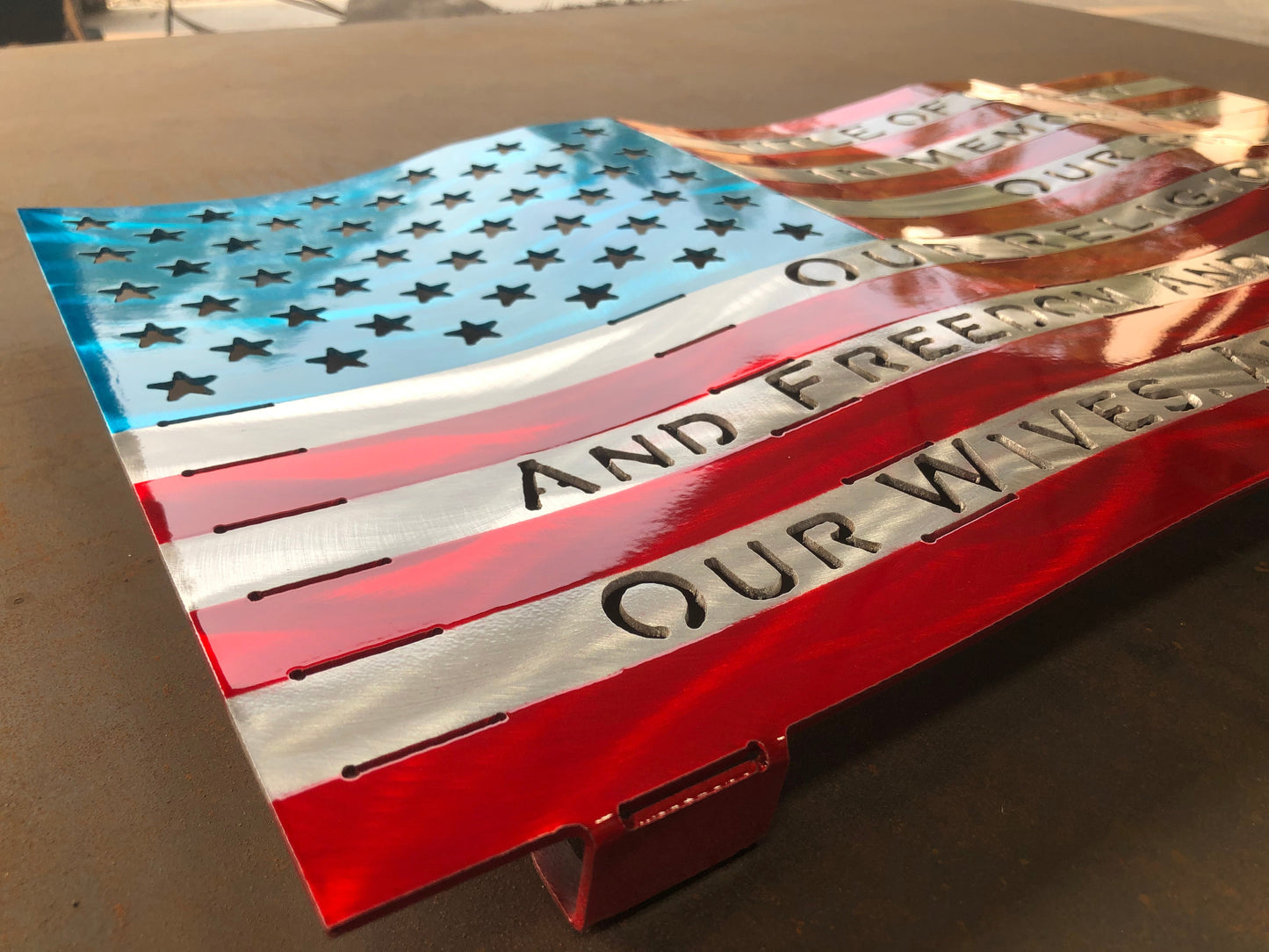 Title of Liberty American Flag, handcrafted from marine-grade aluminum with hand-formed waves and a three-stage powder-coated finish by CnS CnC.