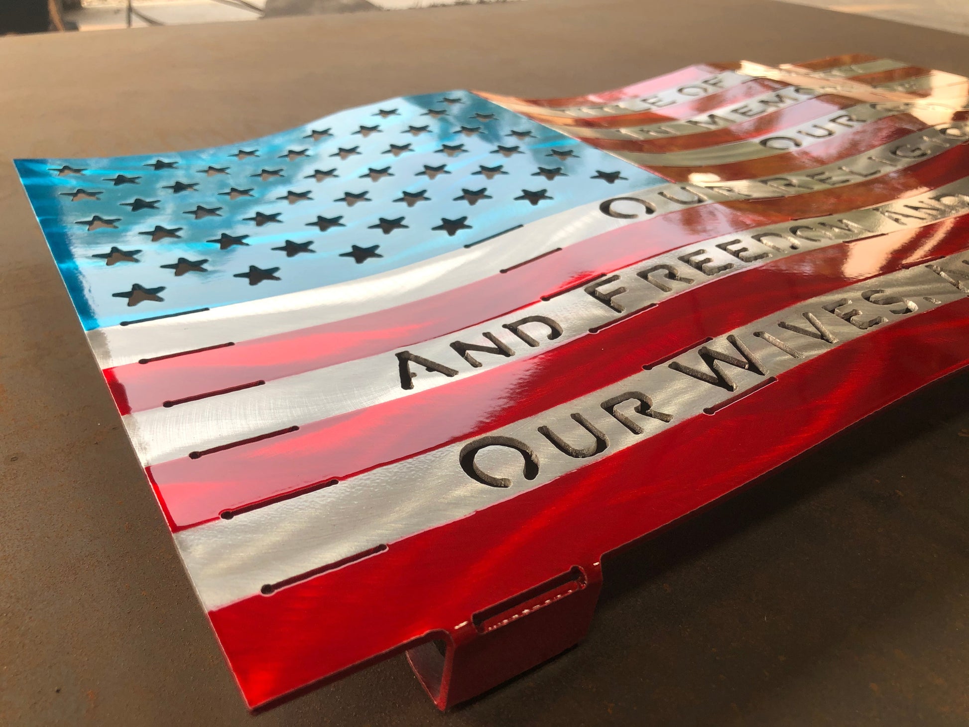 Title of Liberty American Flag, handcrafted from marine-grade aluminum with hand-formed waves and a three-stage powder-coated finish by CnS CnC.